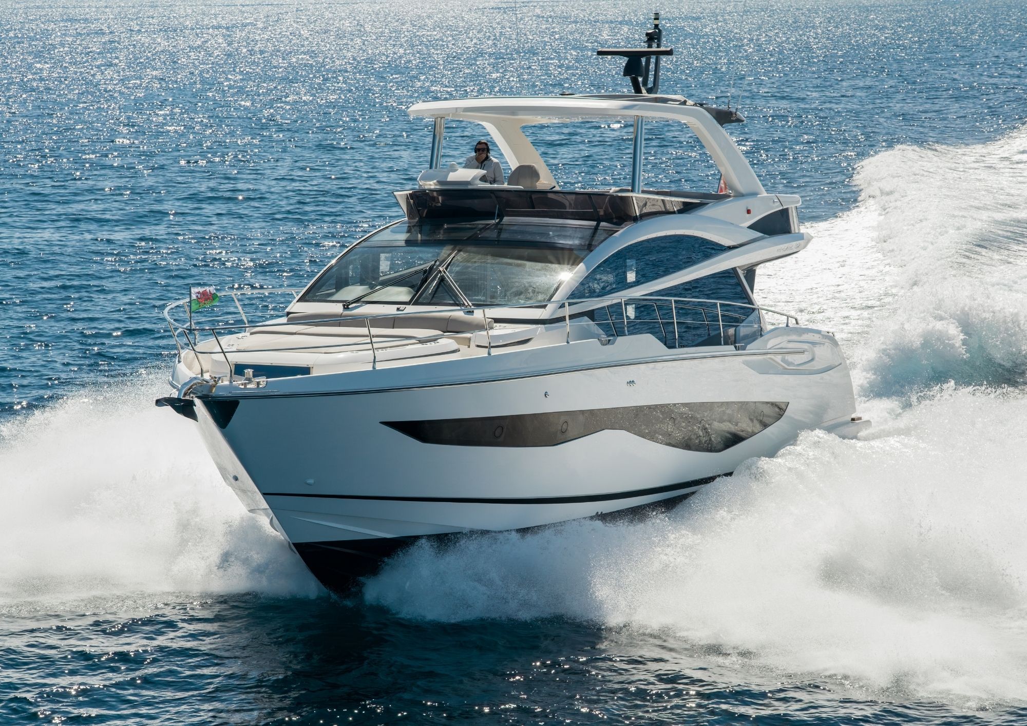 Luxury Pearl 62 yacht cruising on open sea, 2022 model.