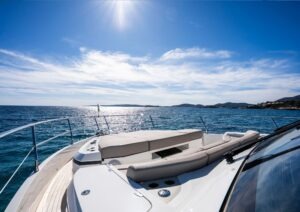 Luxurious Pearl 62 yacht deck, 2022 model, cruising on a sunny ocean.