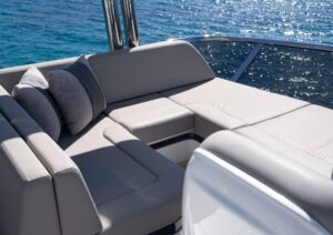 Luxurious seating on 2022 Pearl 62 yacht with ocean view.