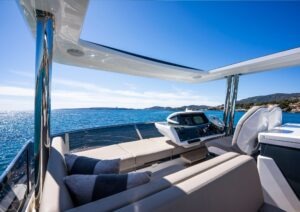 Luxurious 2022 Pearl 62 yacht interior with ocean view and modern helm.