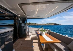 Luxurious 2022 Pearl 62 yacht deck with elegant seating and ocean view.