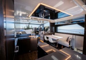 Luxurious interior of 2022 Pearl 62 yacht with modern dining and seating area.