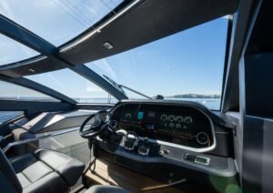 Luxurious 2022 Pearl 62 yacht cockpit with modern controls and panoramic ocean view.
