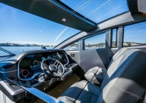 Interior of 2022 Pearl 62 yacht cockpit with modern controls and panoramic windows.