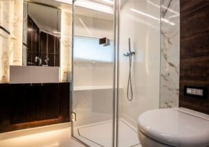 Luxurious modern bathroom with marble accents in a 2022 Pearl 62 model.