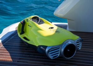 Yellow Pearl 62 sea scooter on yacht deck, 2022 model, near blue ocean water.