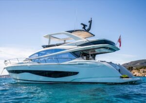 2022 Pearl 62 yacht on blue ocean, sleek design, sunny day.