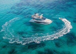 Luxury Pearl 62 yacht cruising in clear blue ocean, 2022 model.