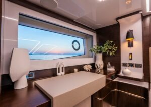 Luxurious interior of 2023 Pearl 62 yacht with elegant decor and ocean view.