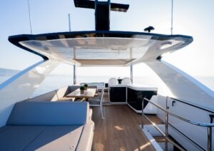 Luxurious 2023 Pearl 62 yacht deck with modern seating and ocean view.