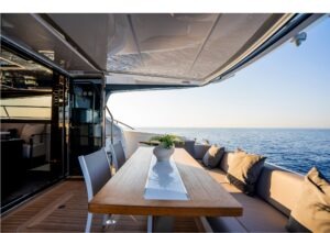 Luxurious Pearl 62 yacht deck with elegant seating, ocean view, and modern design, 2023 model.