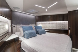 Luxurious bedroom interior of 2021 Sunseeker Manhattan 68 yacht with modern design.