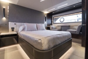 Luxurious interior of 2021 Sunseeker Manhattan 68 yacht with sleek wood cabinetry.