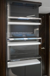 Luxury interior shelving on 2021 Sunseeker Manhattan 68 yacht, featuring sleek design and modern finishes.
