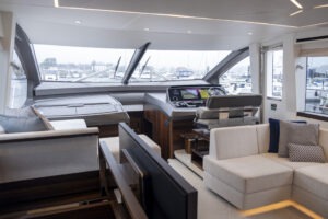 Luxurious interior of 2021 Sunseeker Manhattan 68 yacht with modern helm and seating area.