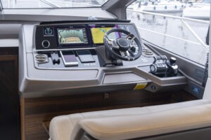 Helm of 2021 Sunseeker Manhattan 68 yacht with advanced navigation controls.