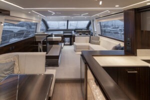 Luxurious interior of 2021 Sunseeker Manhattan 68 yacht with modern furnishings and panoramic windows.
