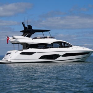 Luxury 2021 Sunseeker Manhattan 68 yacht on calm ocean waters under blue sky.