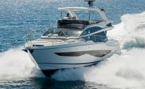 Luxury Pearl 62 yacht cruising on open sea, 2022 model.