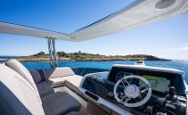Luxurious 2022 Pearl 62 yacht interior with ocean view and modern navigation system.