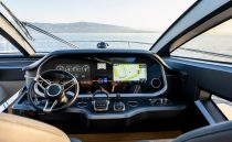 Luxurious 2023 Pearl 62 yacht cockpit with advanced navigation system and scenic ocean view.