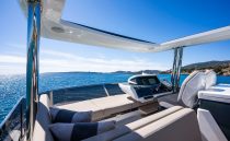 Luxurious 2022 Pearl 62 yacht interior with ocean view and modern helm.