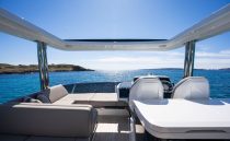 Luxurious 2022 Pearl 62 yacht interior with ocean view and modern seating.