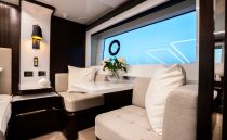 Luxurious interior of 2023 Pearl 62 yacht with elegant seating and modern decor.
