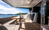 Luxurious Pearl 62 yacht deck with elegant seating and ocean view, 2022 model.