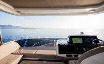 Luxurious 2023 Pearl 62 yacht interior with ocean view and navigation system.