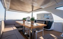 Luxurious 2023 Pearl 62 yacht interior with elegant seating and dining area.