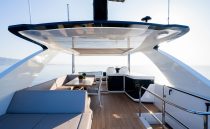 Luxurious 2023 Pearl 62 yacht deck with modern seating and ocean view.