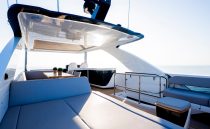 Luxurious 2023 Pearl 62 yacht deck with modern seating and ocean view.