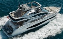 Luxurious 2022 Pearl 62 yacht cruising on open water, showcasing sleek design and spacious deck.