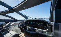 Luxurious 2022 Pearl 62 yacht cockpit with modern controls and panoramic ocean view.
