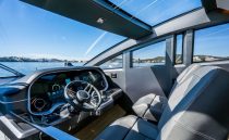 Interior of 2022 Pearl 62 yacht cockpit with modern controls and panoramic windows.