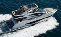 Luxurious 2022 Pearl 62 yacht cruising on open sea, showcasing sleek design and elegance.