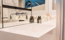 Modern bathroom sink with chrome faucet in 2022 Pearl 62 yacht.