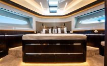 Luxurious interior of 2022 Pearl 62 yacht with modern design and ambient lighting.