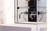 Modern bathroom faucet with marble backdrop, Pearl 62 model, 2022 design.