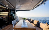 Luxurious Pearl 62 yacht deck with elegant seating, ocean view, and modern design, 2023 model.