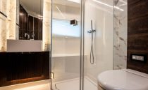 Luxurious modern bathroom with marble accents in a 2022 Pearl 62 model.