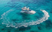 Luxury Pearl 62 yacht cruising in clear blue ocean, 2022 model.