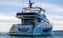 Luxury Pearl 62 yacht from 2022 on open water, showcasing sleek design and elegance.