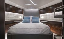Luxurious bedroom interior of 2021 Sunseeker Manhattan 68 yacht with modern design.