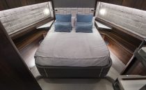 Luxurious bedroom interior of 2021 Sunseeker Manhattan 68 yacht with modern design.