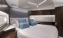Luxurious bedroom interior of 2021 Sunseeker Manhattan 68 yacht with modern design.