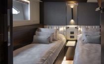 Luxurious twin cabin interior of 2021 Sunseeker Manhattan 68 yacht, featuring modern design.