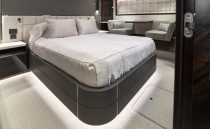 Luxurious bedroom interior of 2021 Sunseeker Manhattan 68 yacht, featuring modern design and elegant furnishings.