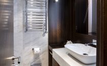 Luxurious bathroom in 2021 Sunseeker Manhattan 68 yacht with modern fixtures and elegant design.